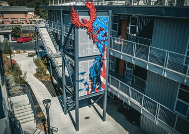 a large mural of a red and blue bird on the side of a building at ROCKY HILL VETERANS HOUSING, VACAVILLE, 95688 