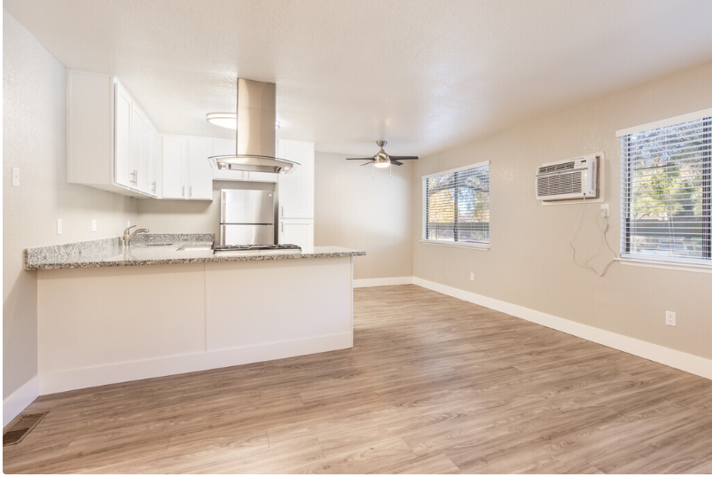 Kitchen with appliance and white cabinets