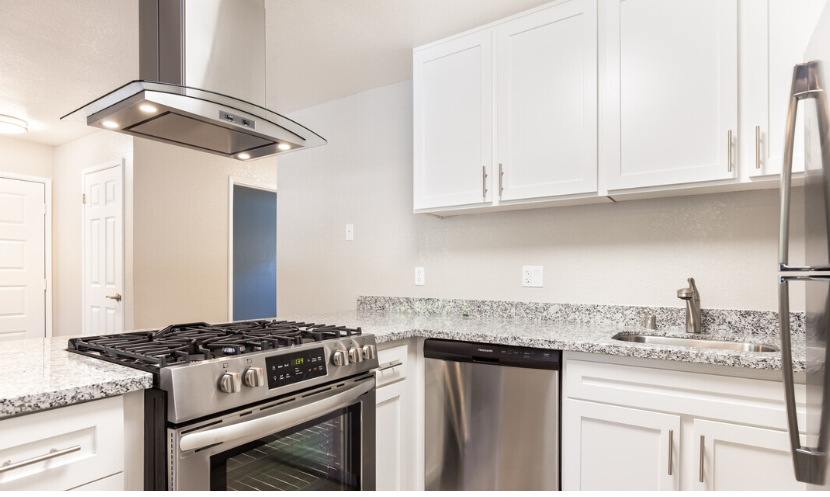 Kitchen with appliance and white cabinets