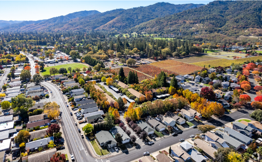 Ariel view of community and city skyline