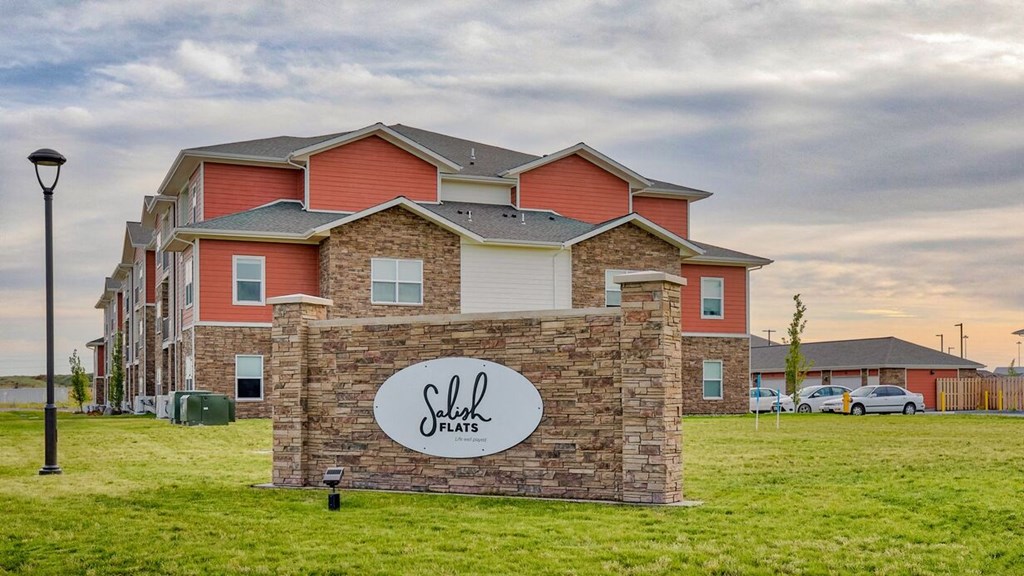 Apartments near Sunset Park- Salish Flats- Monument Sign with Landscaping and Building Exterior View