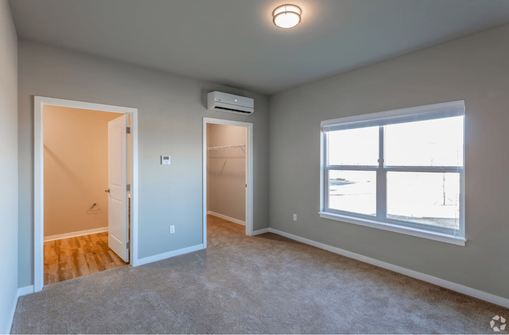 large bedroom with carpet