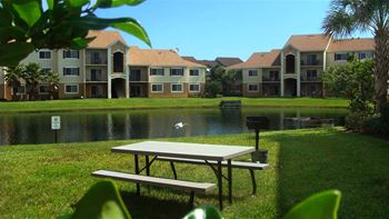 San Marco community exterior with lake and picnic area