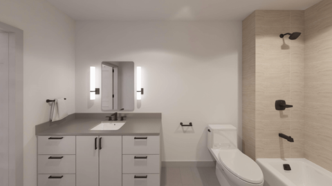 A modern bathroom with a white toilet and a white sink.
