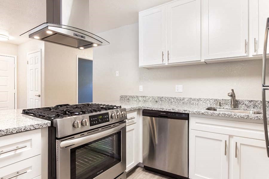 Kitchen with white cabinets and appliances
