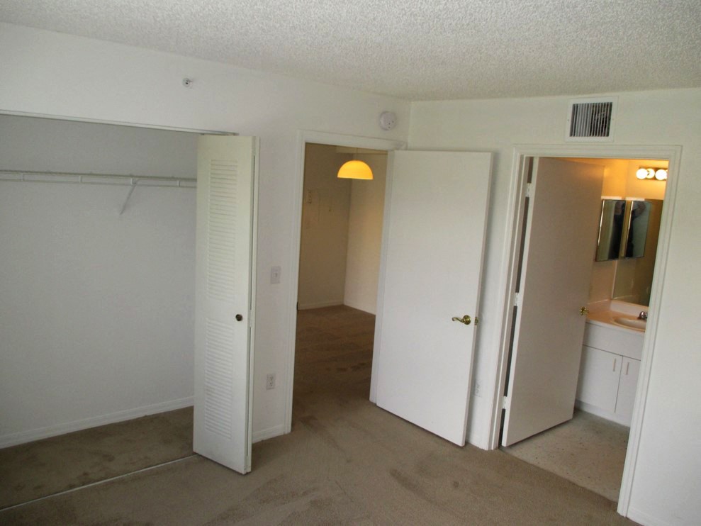 Siesta Pointe carpeted bedroom with on-suite bathroom at Siesta Pointe, Hialeah, 33015