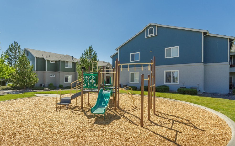 Stead, NV Apartments - Sky Vista Commons - Playground with Slide, Woodchucks, and Manicured Lawn