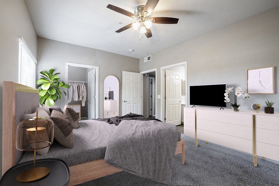a bedroom with a large bed and a ceiling fan