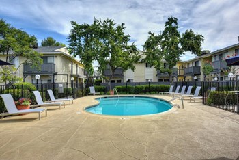 Rocklin, CA Apartments - Exterior View of The Everette Apartments Building Surrounded By Lush Landscaping and Swimming Pool - Photo Gallery 3