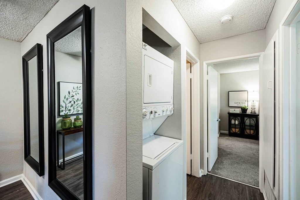 a view of a kitchen and a hallway with a mirror at SYCAMORE GREENS APARTMENT HOMES, Vista, CA, 92081