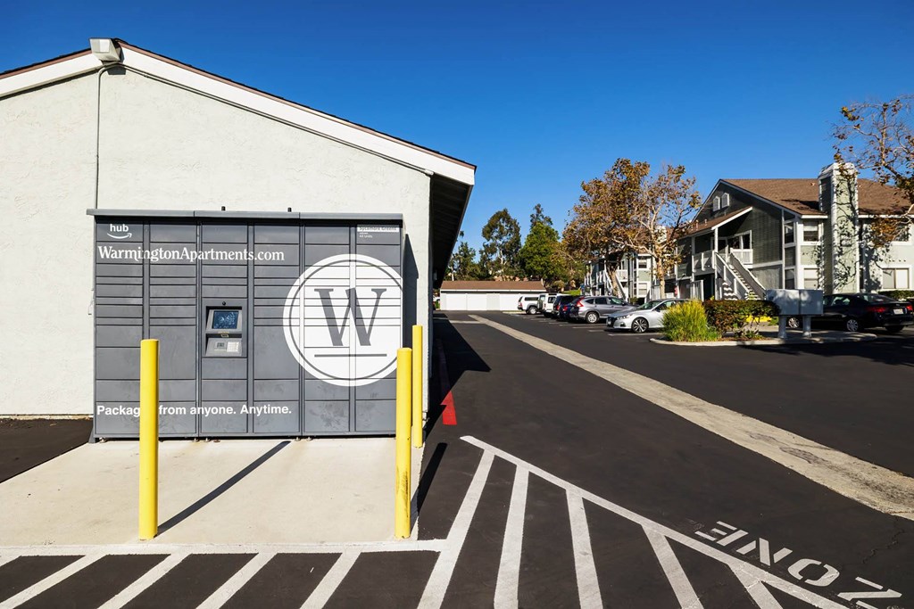 the front of a building with a black and white painted street