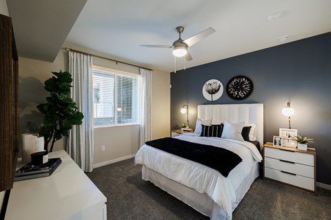 a bedroom with a bed and a ceiling fan at SYNC APARTMENT HOMES, North Las Vegas Nevada