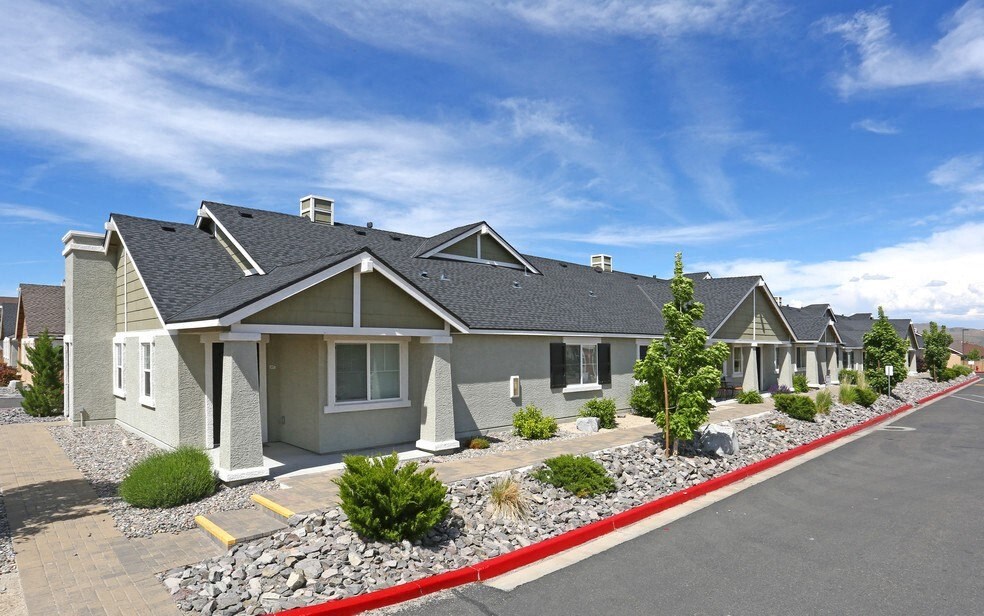 a row of houses with a street in front of them