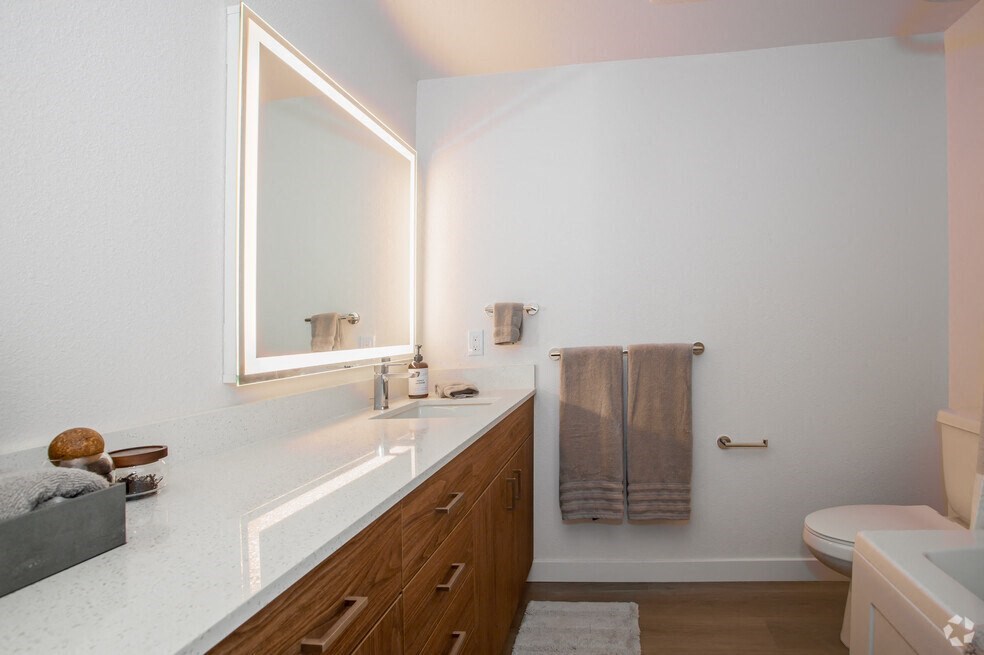 a bathroom with a sink and a mirror AT MIDTOWN Apartments, SACRAMENTO, CA, 90028