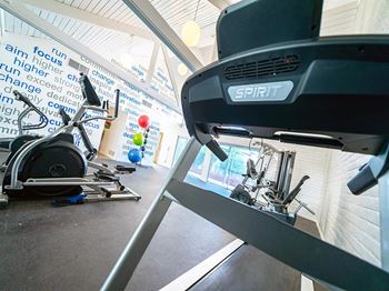a treadmill and other exercise equipment in the gym at DESERT PEAKS, Texas