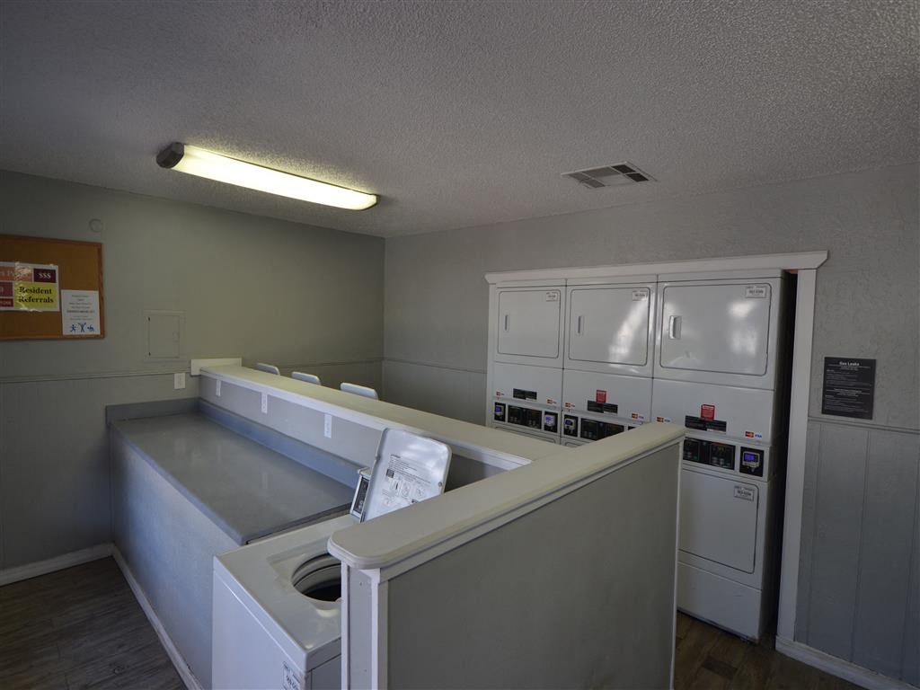 a laundry room with a washer and dryer at DESERT PEAKS, EL PASO, Texas