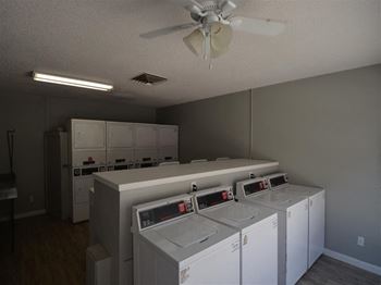 a group of white washers and dryers in a room at DESERT PEAKS, EL PASO Texas