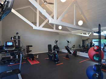 a gym with a lot of exercise equipment at DESERT PEAKS, EL PASO Texas