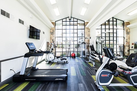 Fitness room with cardio and strength equipment at THE CLUBS AT RHODES RANCH APARTMENT HOMES, Las Vegas, NV