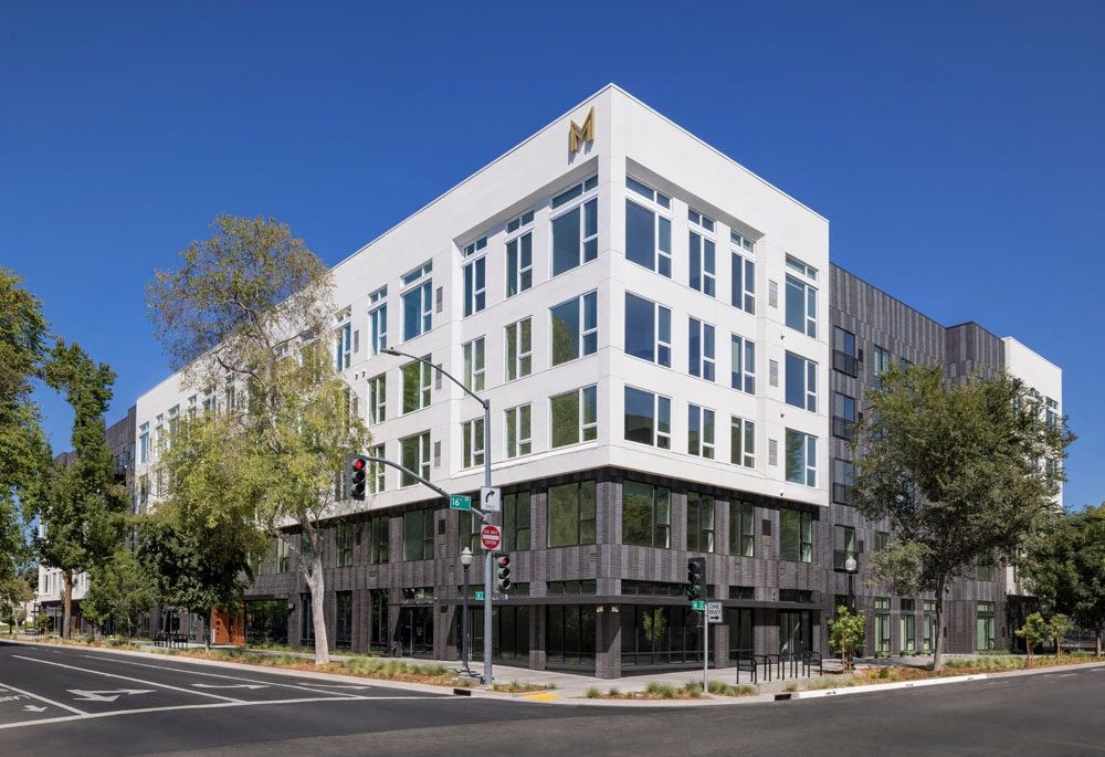 Downtown Sacramento, CA Apartments - The Mansion - Building Exterior with White and Gray Details, from Street View, with Surrounding Trees