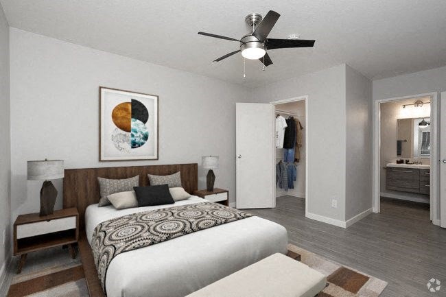 bedroom with bathroom and closet