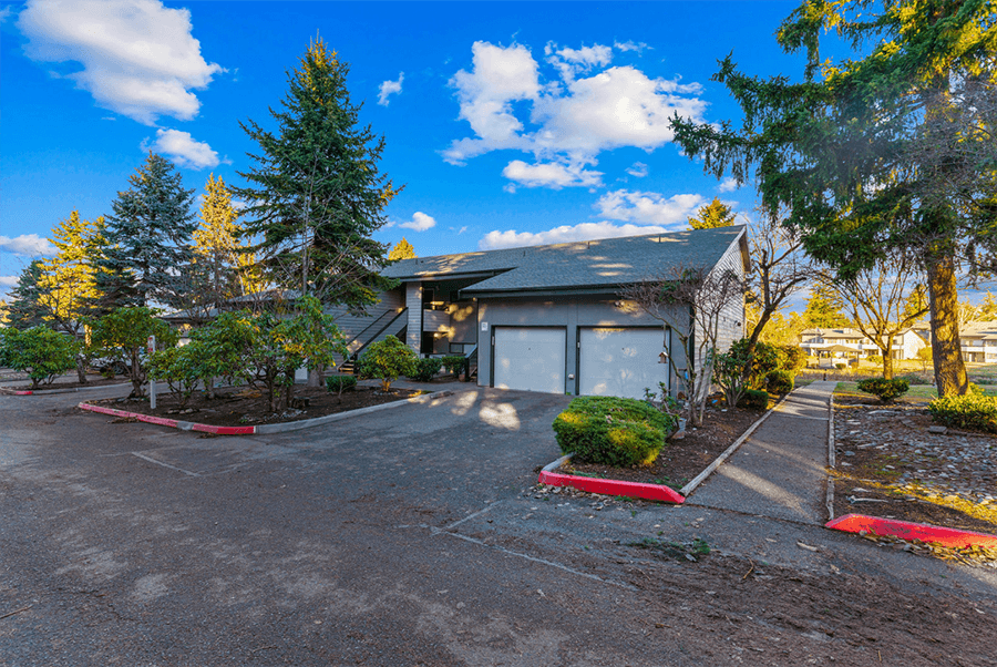 Kent WA Apartments - Township Lake Meridian - Driveway and Garage Surrounded by Trees