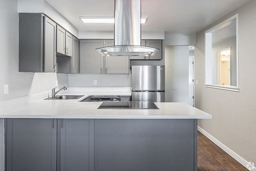 Two BR Apartments in Portland OR - Township Eastside - Kitchen with Grey Cabinets, White Countertops, and Stainless Steel Appliances