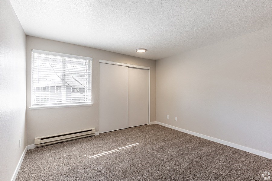 2 BR Apartments in Portland OR - Township Eastside - Empty Bedroom with Wall-to-wall Carpet, Window, and Closet