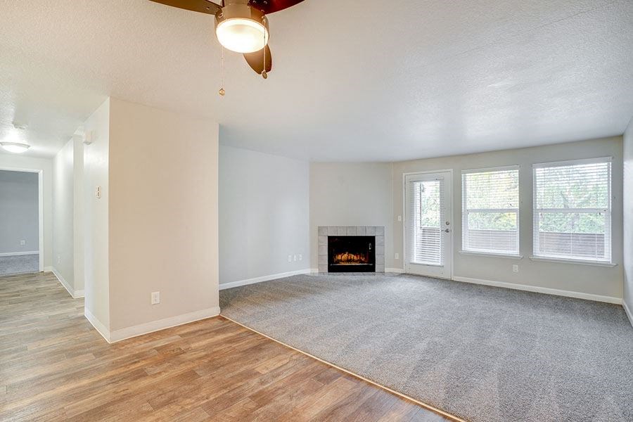 Living room with fireplace near window at TOWNSHIP Apartments, CANBY, OR 97013
