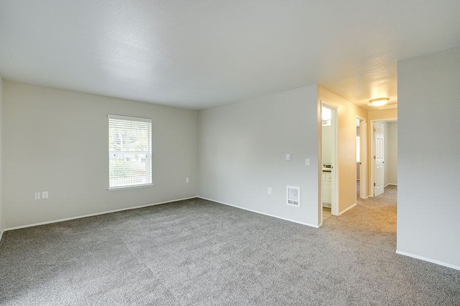 Living room with window at TOWNSHIP Apartments, Oregon 97013