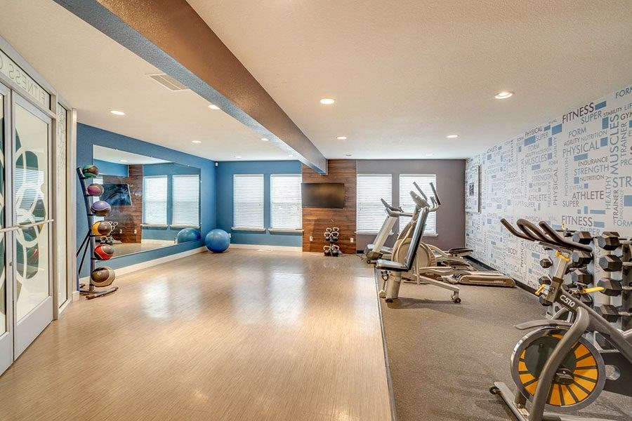 Gym with fitness equipment at TOWNSHIP Apartments, CANBY