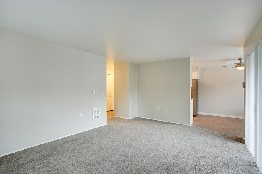 Living room near patio and kitchen at TOWNSHIP Apartments, CANBY, OR 97013