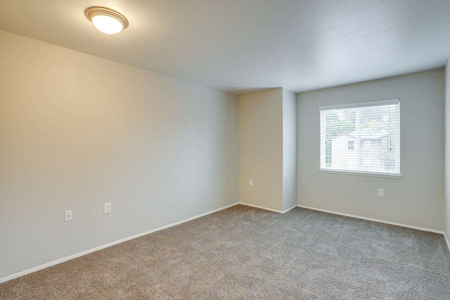 Room with carpet and window at TOWNSHIP Apartments, CANBY