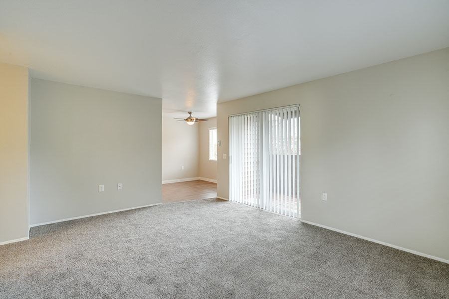 Living room with patio doors at TOWNSHIP Apartments, Oregon 97013