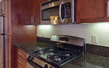 a kitchen with a stove and a microwave