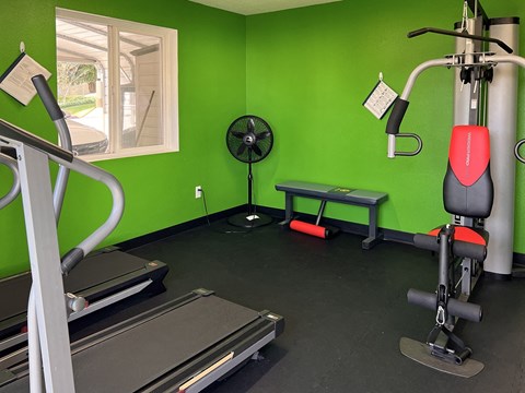 Black Floorings, Green Painted Walls, Gym Equipment, and Corner Fan at TOWNSHIP SHERWOOD, Sherwood, OR