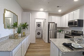 Kitchen with appliances and washer and dryer