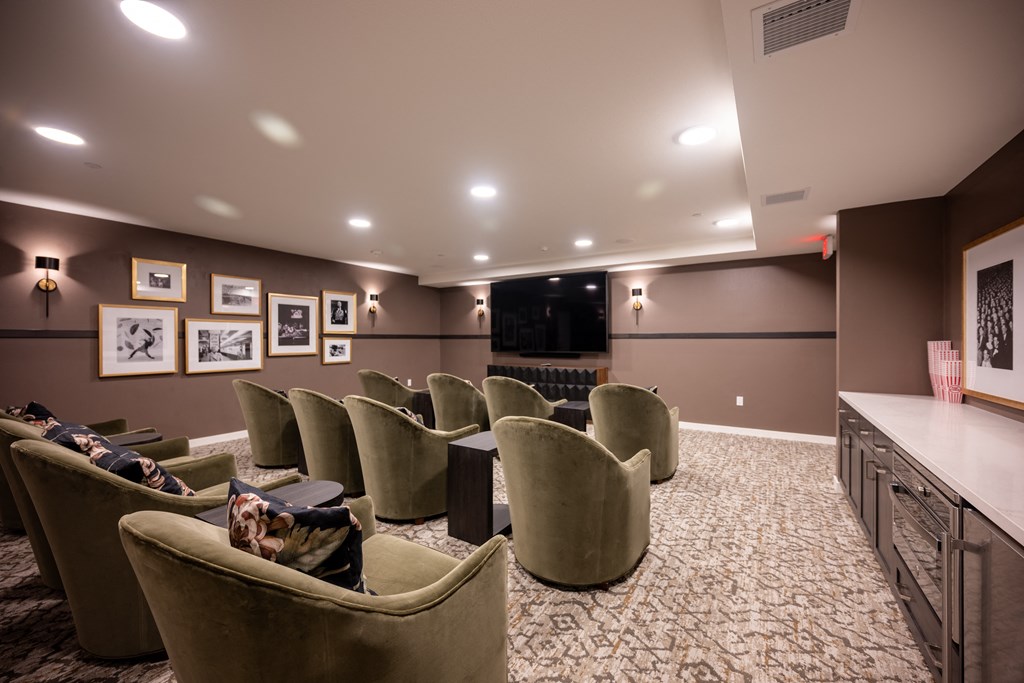 a large screening room with a projector screen and chairs at Vintage at Anacapa Canyon, California