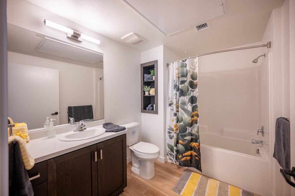 a bathroom with a shower toilet and sink and a mirror at Vintage at Anacapa Canyon, Camarillo
