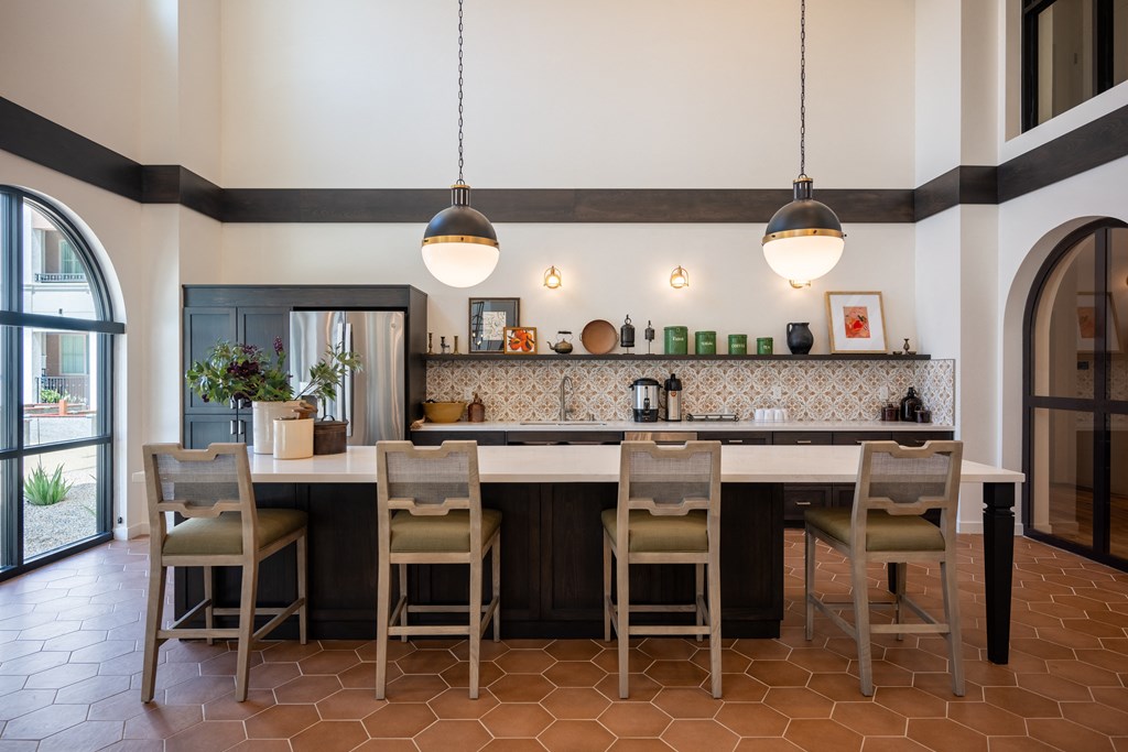 a kitchen with a large island with chairs and a table at Vintage at Anacapa Canyon, Camarillo