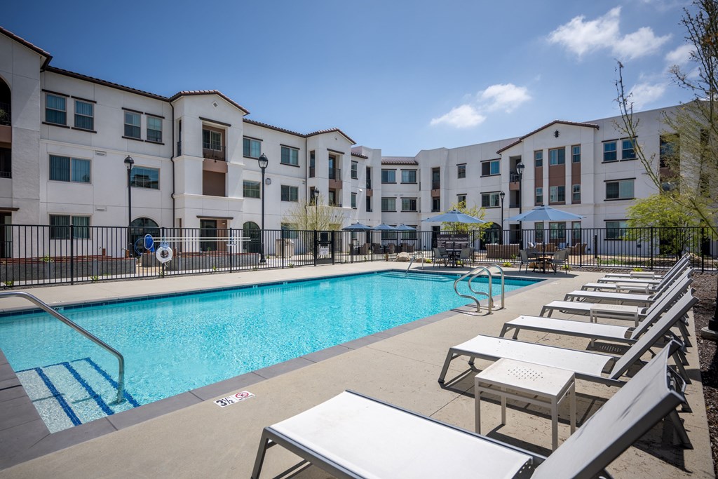 our apartments have a large pool and lounge chairs at Vintage at Anacapa Canyon, California