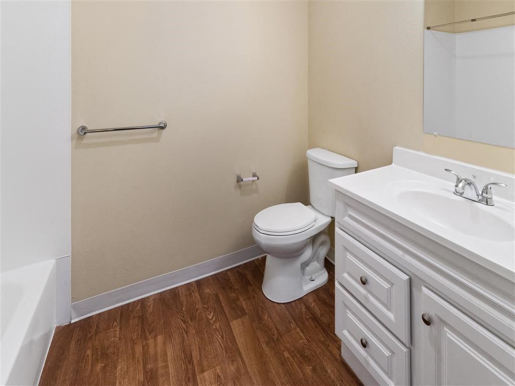 a bathroom with a toilet sink and bathtub at Webster Court Senior Apartments, Kent