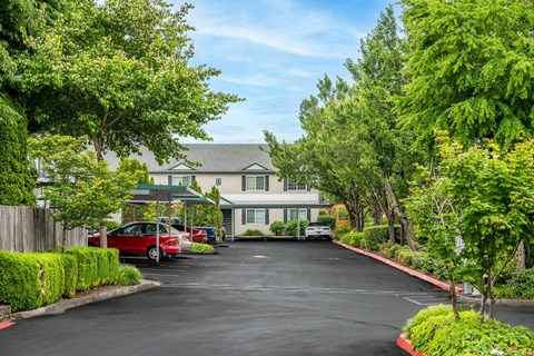 A parking lot in front of a building with cars parked.at Vancouver Mall Apartments, Vancouver, WA ? 