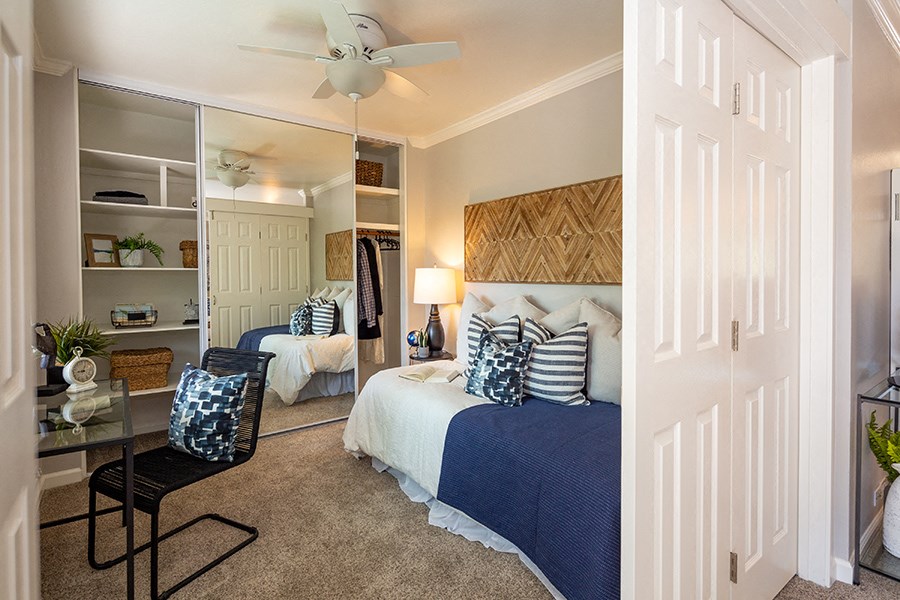 Walnut Hill Apartments in Walnut Creek, CA large bedroom with ceiling fan and balcony access
