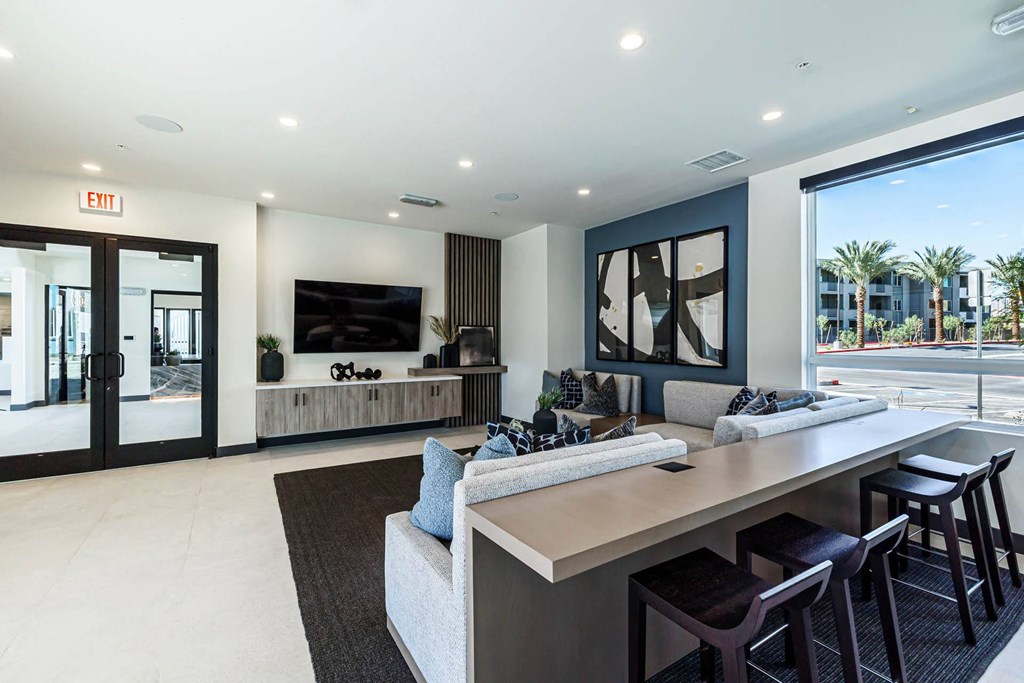 a large living room with a bar and a television at BASE APARTMENT HOMES, LAS VEGAS, 89166