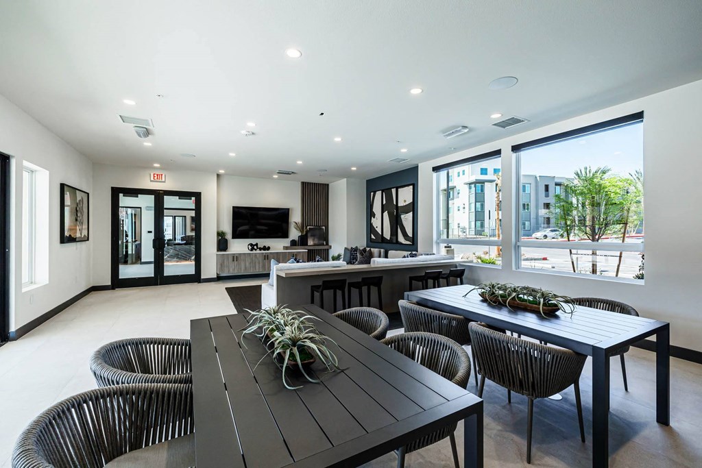 a dining room and living room with a table and chairs at BASE APARTMENT HOMES, LAS VEGAS, NV