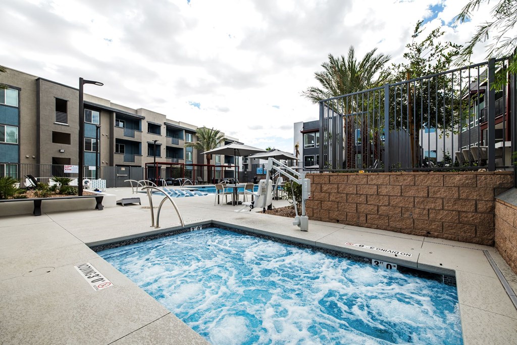 a resort style pool is next to an apartment building at BASE APARTMENT HOMES, Nevada