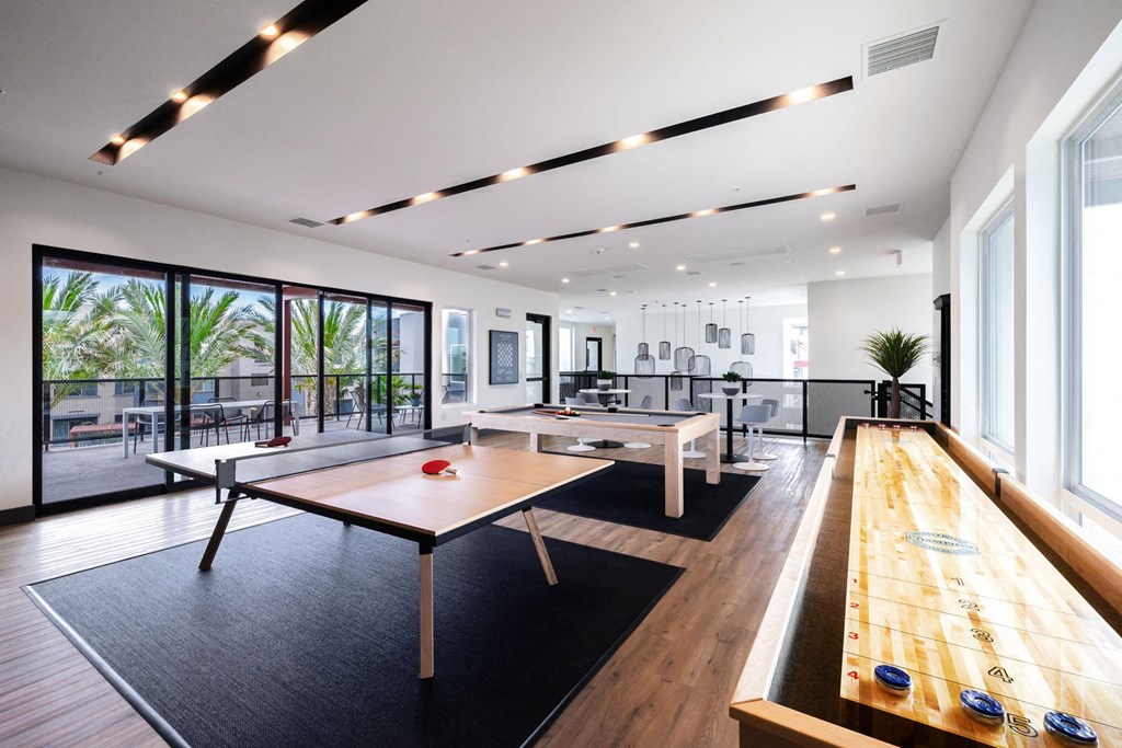 a game room with ping pong tables and a pool table at BASE APARTMENT HOMES, LAS VEGAS, NV