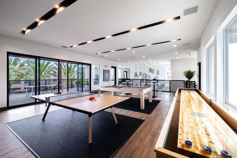 a game room with ping pong tables and a pool table at BASE APARTMENT HOMES, LAS VEGAS, NV
