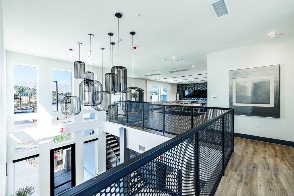 a large kitchen with a long counter and a staircase at BASE APARTMENT HOMES, LAS VEGAS